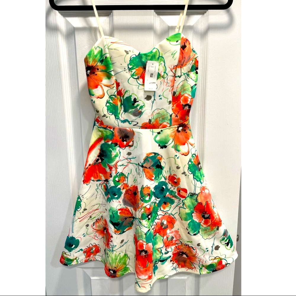 Brand new, never worn, size Medium spaghetti strap dress.